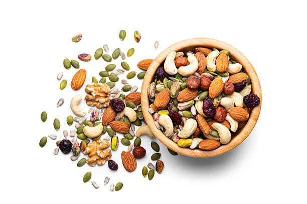 Healthy snack options with nuts fruits and vegetables